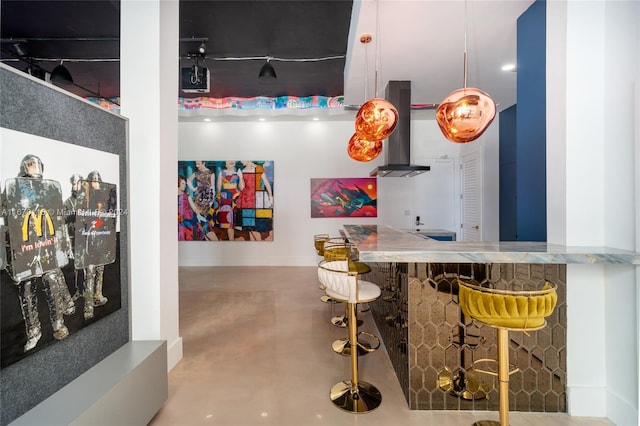 bar with concrete flooring and extractor fan