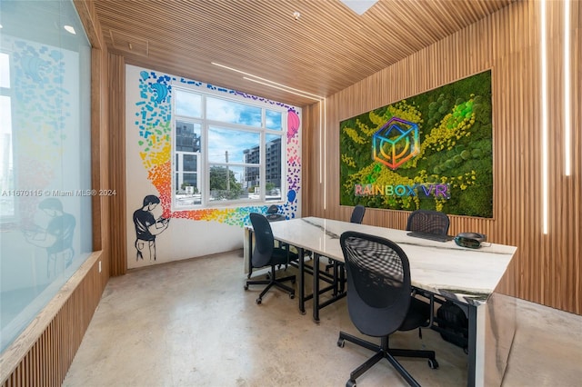 home office featuring wooden walls