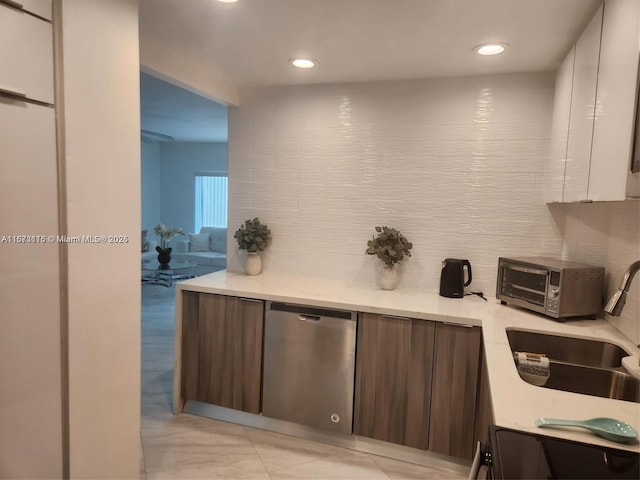 4330 Hillcrest Dr Unit 414, Hollywood, FL 33021 - kitchen with dishwasher, light countertops, range, a sink, and backsplash