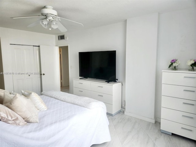 4330 Hillcrest Dr Unit 414, Hollywood, FL 33021 - bedroom featuring light marble finish flooring, a closet, and a ceiling fan