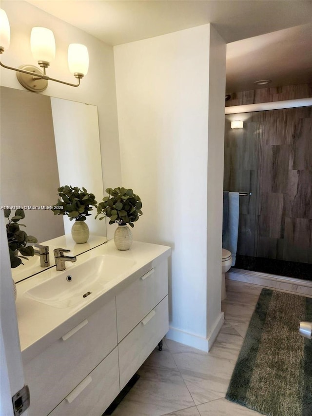 4330 Hillcrest Dr Unit 414, Hollywood, FL 33021 - bathroom featuring vanity, a stall shower, toilet, marble look tile flooring, and baseboards
