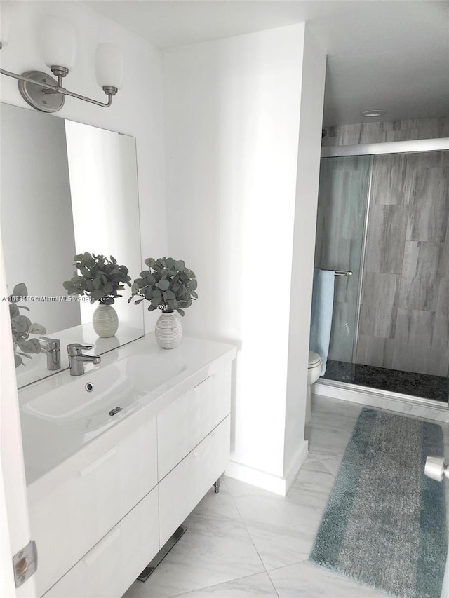 4330 Hillcrest Dr Unit 414, Hollywood, FL 33021 - bathroom featuring vanity, a shower stall, marble look tile flooring, toilet, and baseboards