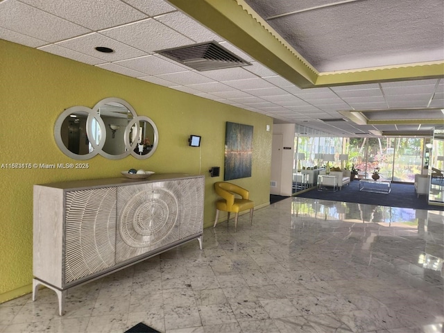 4330 Hillcrest Dr Unit 414, Hollywood, FL 33021 - miscellaneous room featuring a drop ceiling, a textured wall, and baseboards
