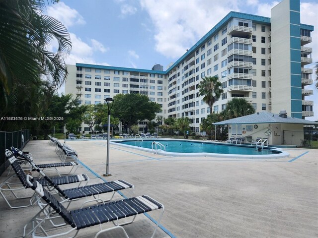 4330 Hillcrest Dr Unit 414, Hollywood, FL 33021 - community pool featuring a patio