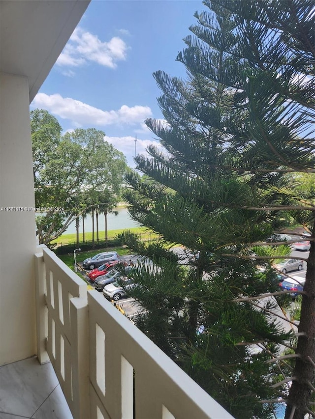 balcony featuring a water view