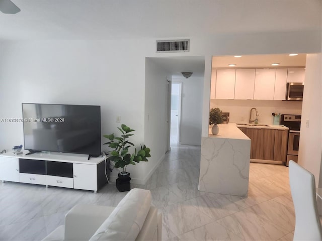 4330 Hillcrest Dr Unit 414, Hollywood, FL 33021 - living area featuring light marble finish floors
