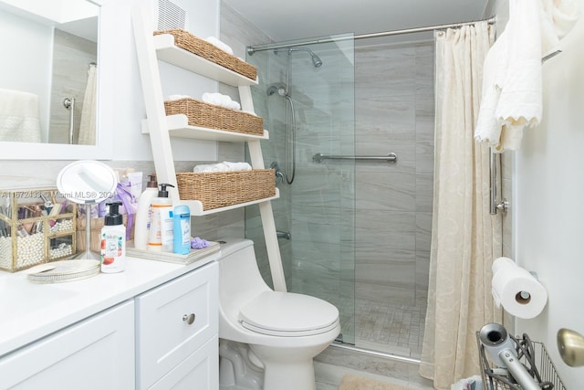 bathroom featuring vanity, toilet, and a shower with shower curtain