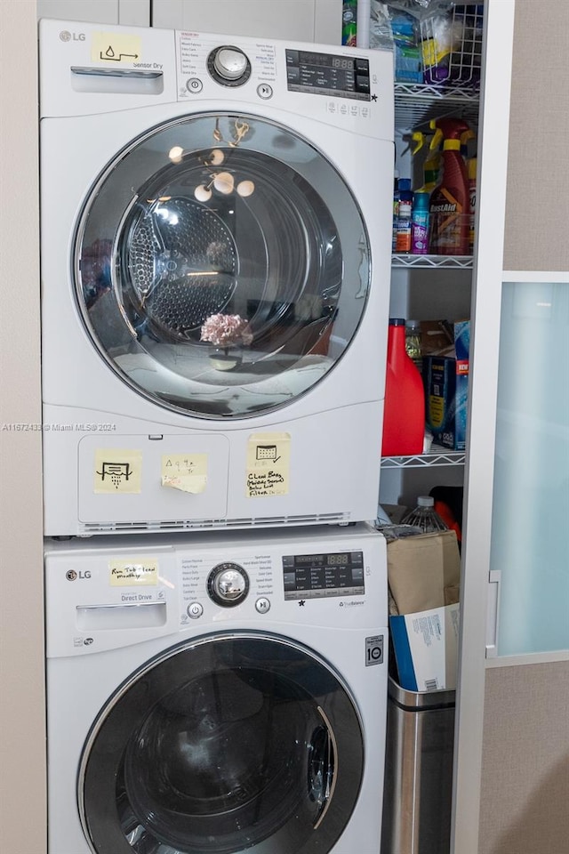 laundry room with stacked washer / dryer