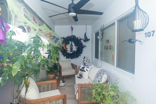 sunroom / solarium with ceiling fan