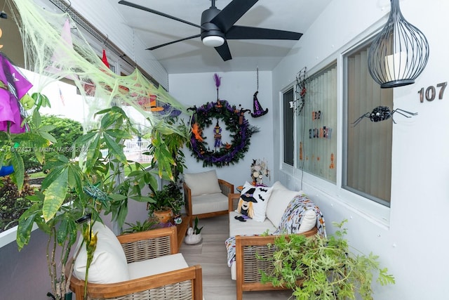 interior space with ceiling fan