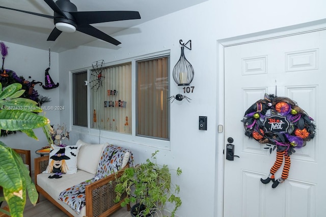 view of exterior entry featuring ceiling fan