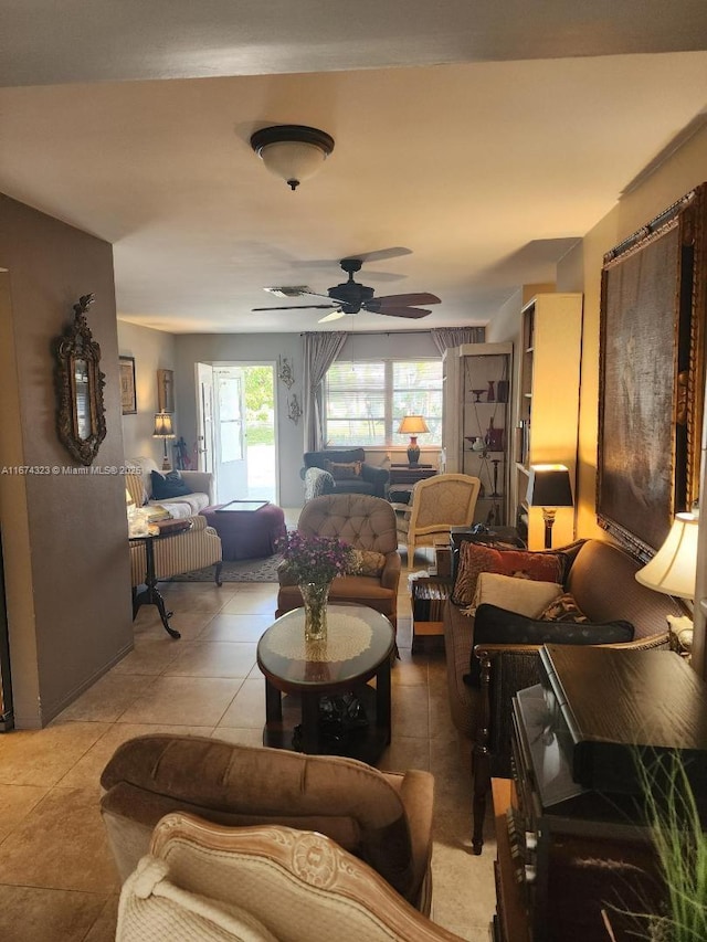 tiled living room featuring ceiling fan