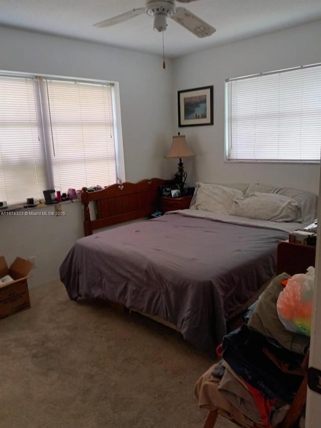 bedroom featuring a ceiling fan and carpet floors
