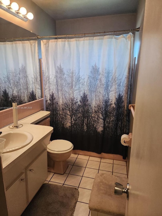 full bathroom featuring toilet, tile patterned flooring, vanity, and a shower with curtain