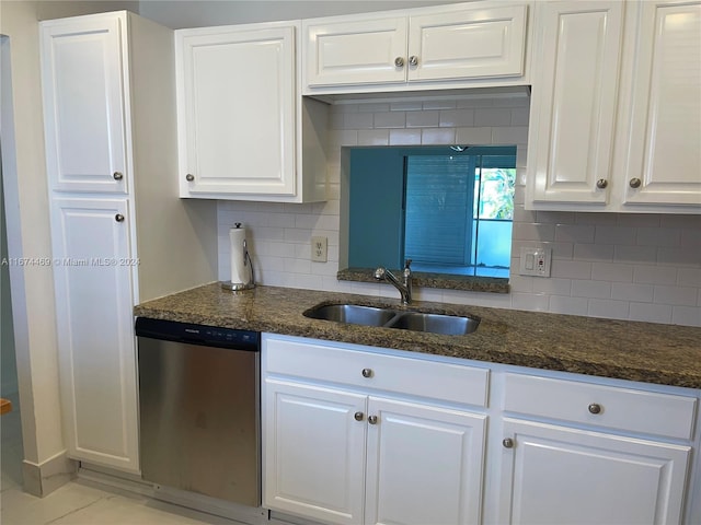 kitchen with dishwasher, white cabinets, and sink