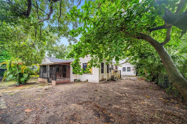 back of property featuring a sunroom