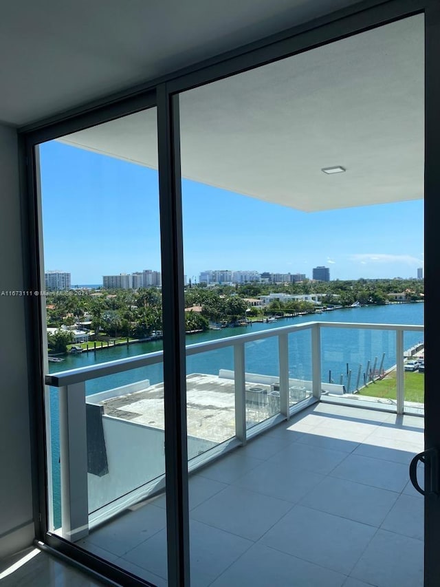 balcony featuring a water view