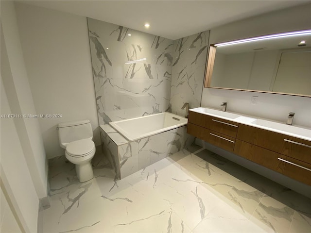 bathroom with vanity, toilet, and a washtub