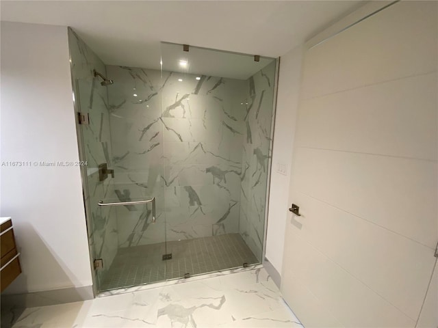 bathroom featuring walk in shower and vanity