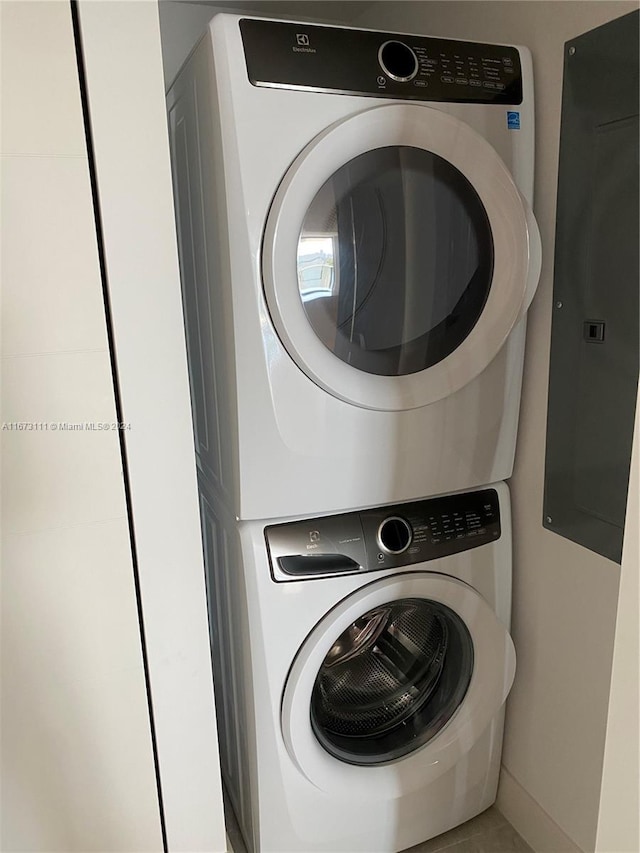 9521 E Bay Harbor Dr Unit 605, Bay Harbor Islands, FL 33154 - laundry area with stacked washer / dryer and electric panel