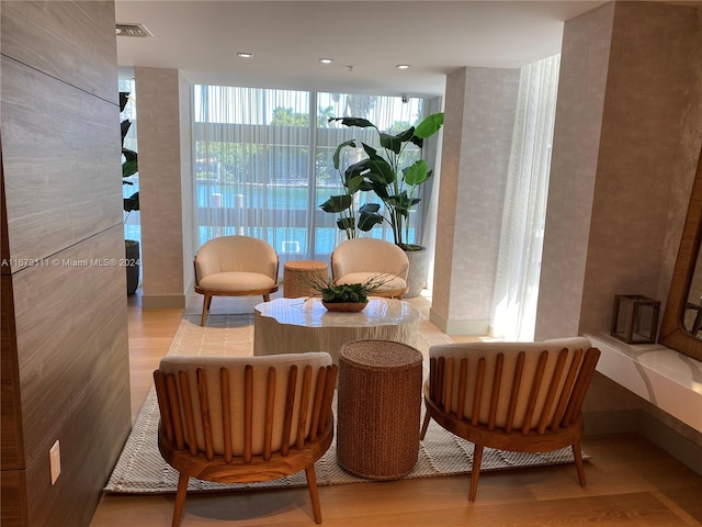 sitting room with hardwood / wood-style flooring