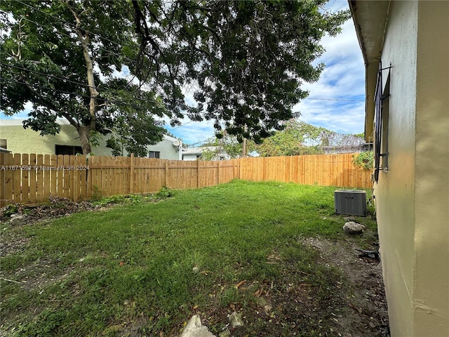 view of yard featuring central AC