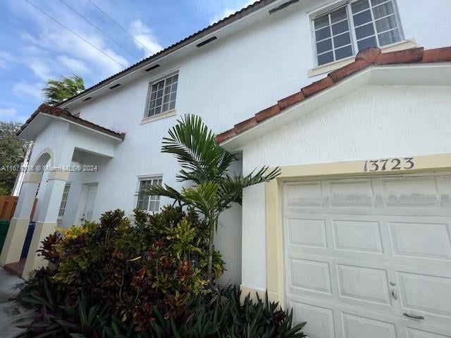 view of property exterior featuring a garage