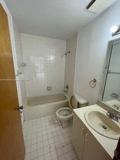 full bathroom with vanity, tile patterned flooring, toilet, and tiled shower / bath combo