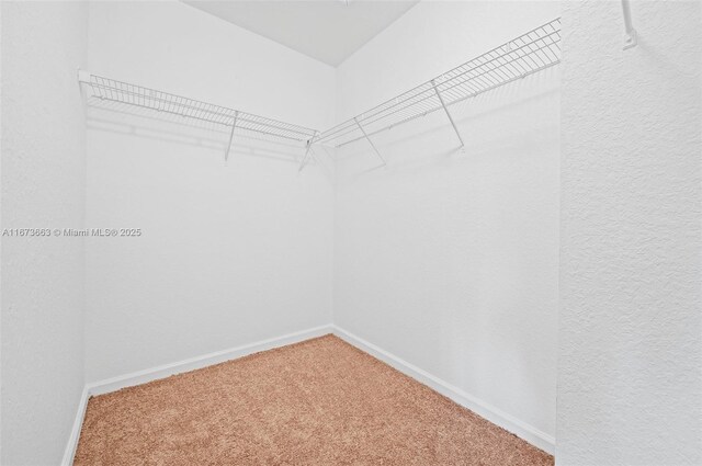 bathroom with vanity, tile patterned flooring, and walk in shower