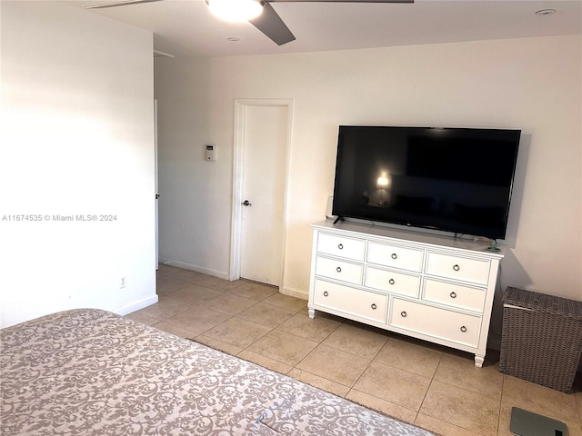 unfurnished bedroom featuring light tile patterned flooring and ceiling fan