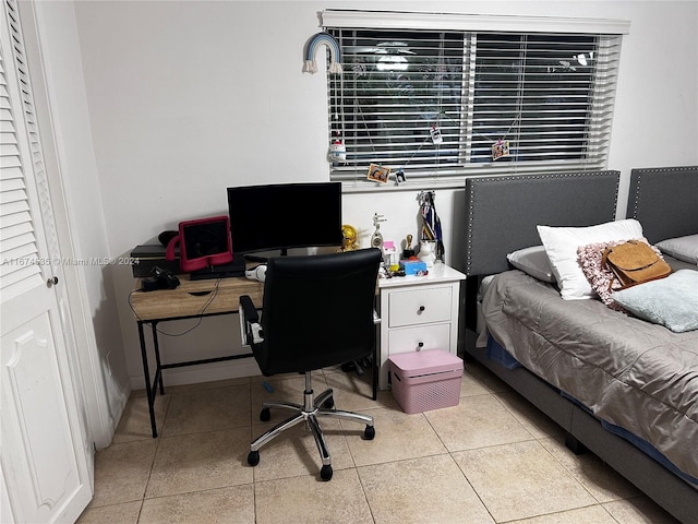 bedroom with light tile patterned floors