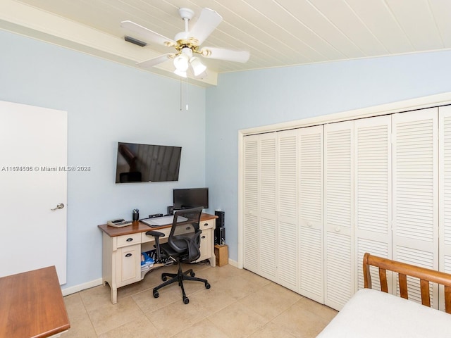 bedroom featuring lofted ceiling, ceiling fan, a closet, wood ceiling, and light tile patterned floors