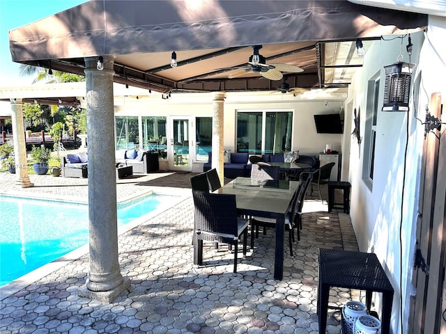 exterior space featuring an outdoor hangout area and ceiling fan