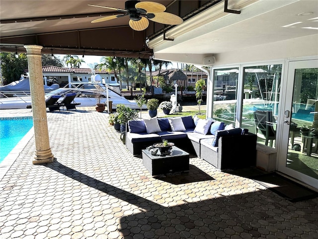 view of patio with ceiling fan and outdoor lounge area