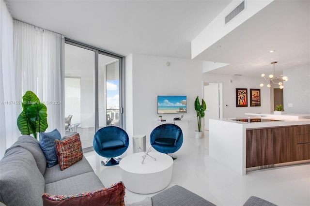 living room featuring a wall of windows, a chandelier, and light tile patterned floors