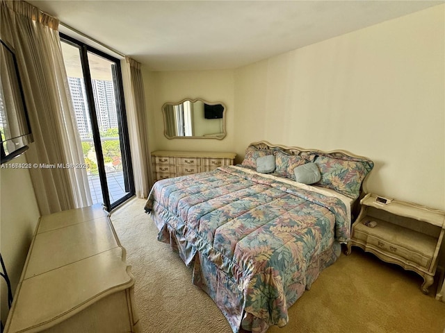 carpeted bedroom featuring access to outside and floor to ceiling windows