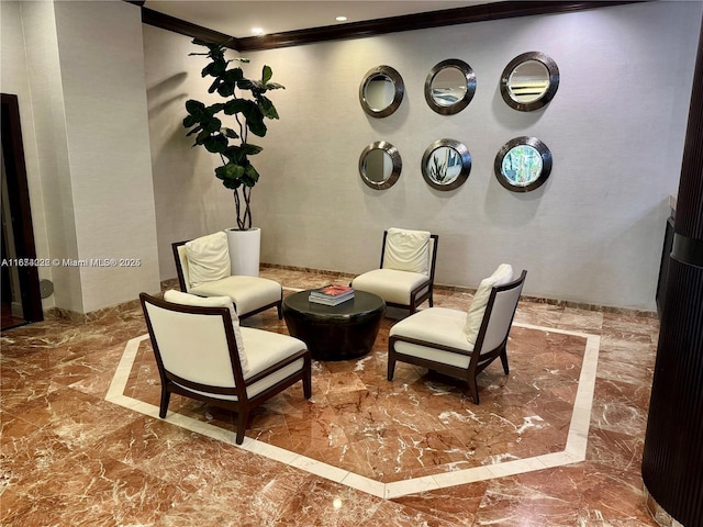 living area with marble finish floor and crown molding