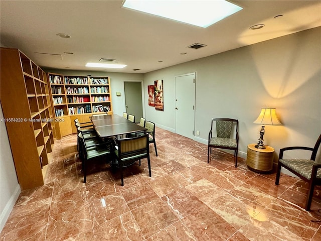 dining space featuring visible vents and baseboards