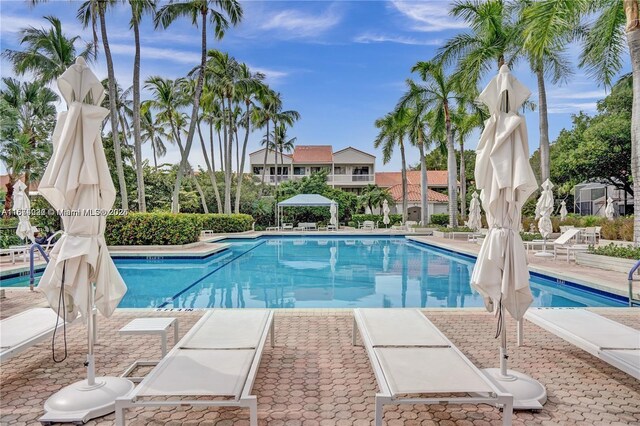 view of swimming pool featuring a patio area