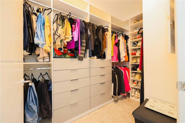 spacious closet with light tile patterned flooring