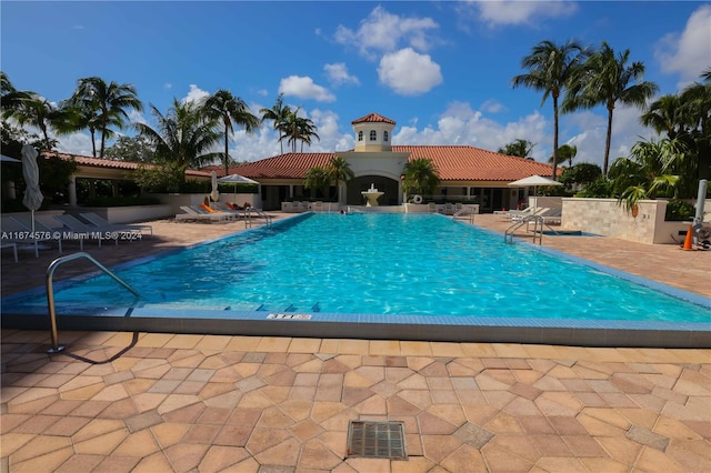 view of swimming pool featuring a patio area