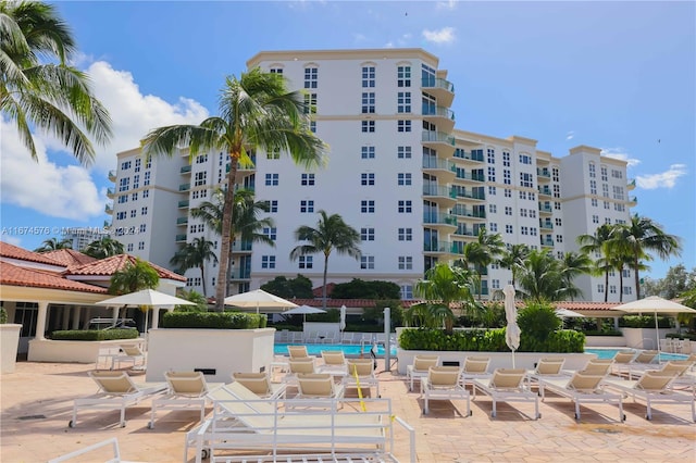 view of building exterior featuring a community pool