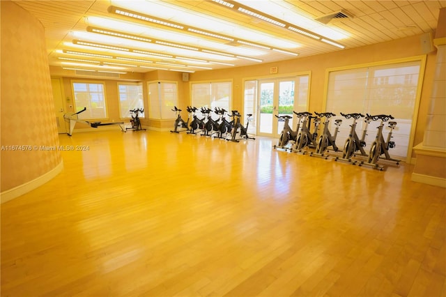 exercise room with hardwood / wood-style flooring