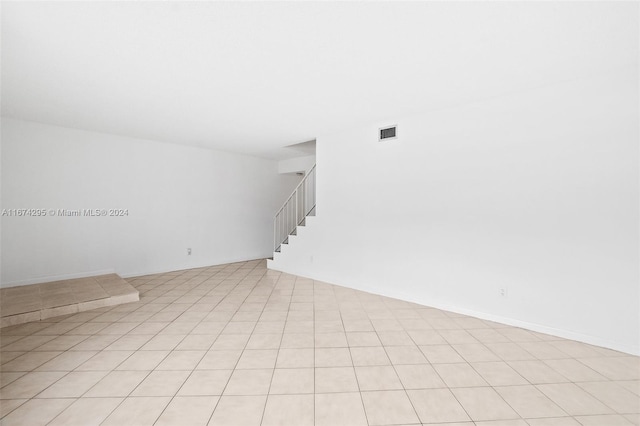 spare room featuring light tile patterned floors