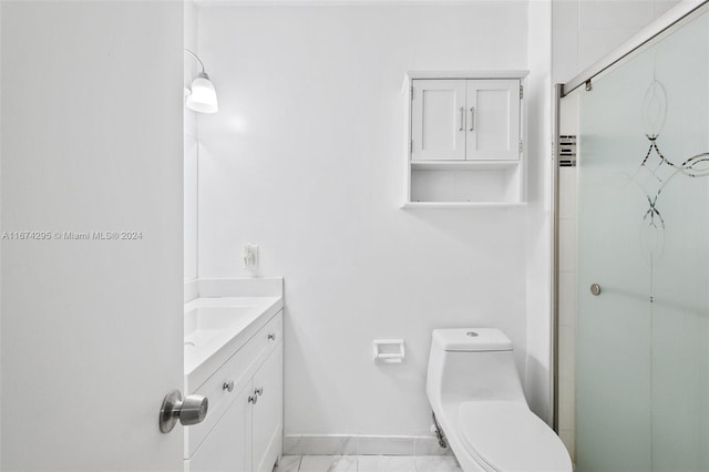 bathroom with an enclosed shower, vanity, and toilet