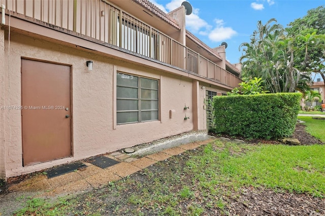 view of property exterior featuring a lawn