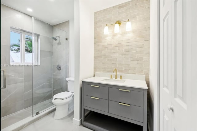 bathroom with tile patterned flooring, a shower with door, vanity, and toilet