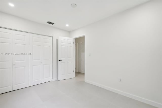 unfurnished bedroom with a closet