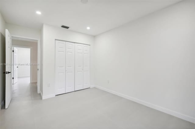 unfurnished bedroom featuring a closet