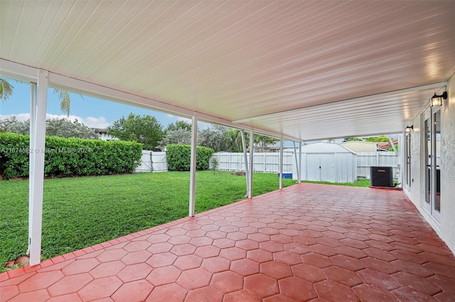 view of patio / terrace featuring cooling unit and a storage unit